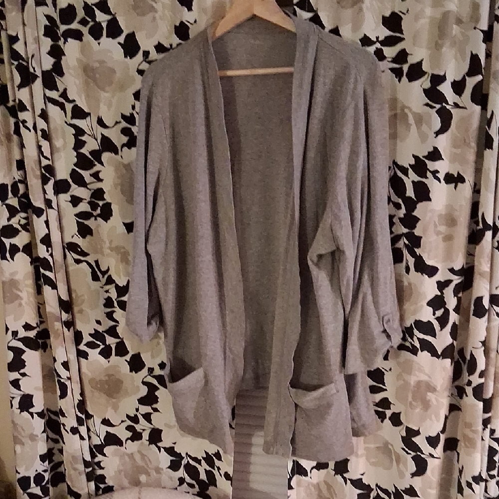 Grey Open Front Cartigan With Pockets And Button Up Sleeves.